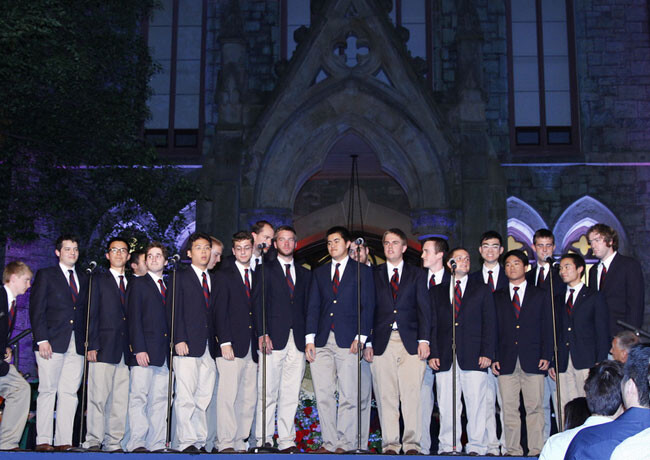 2010 choral group lined up in blue blazers, ties and tan pants