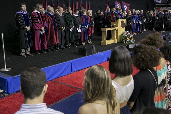 faculty on stage during Convocation 2013