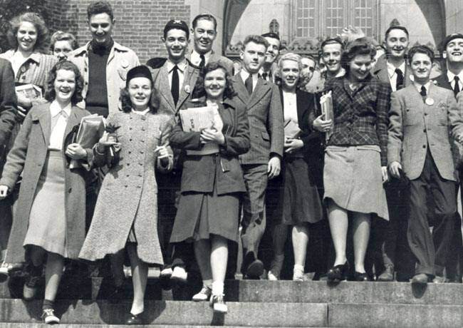 1940 students walking down steps at Convocation ceremony.