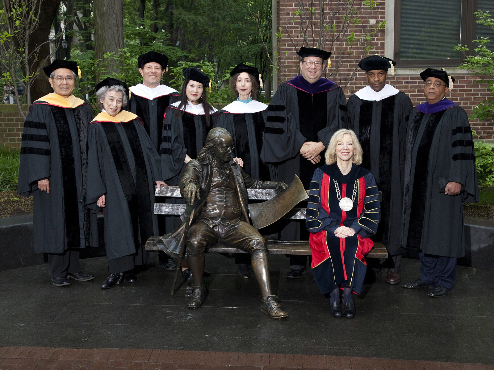 Amy Gutmann and 2011 honorary degree recipients in regalia
